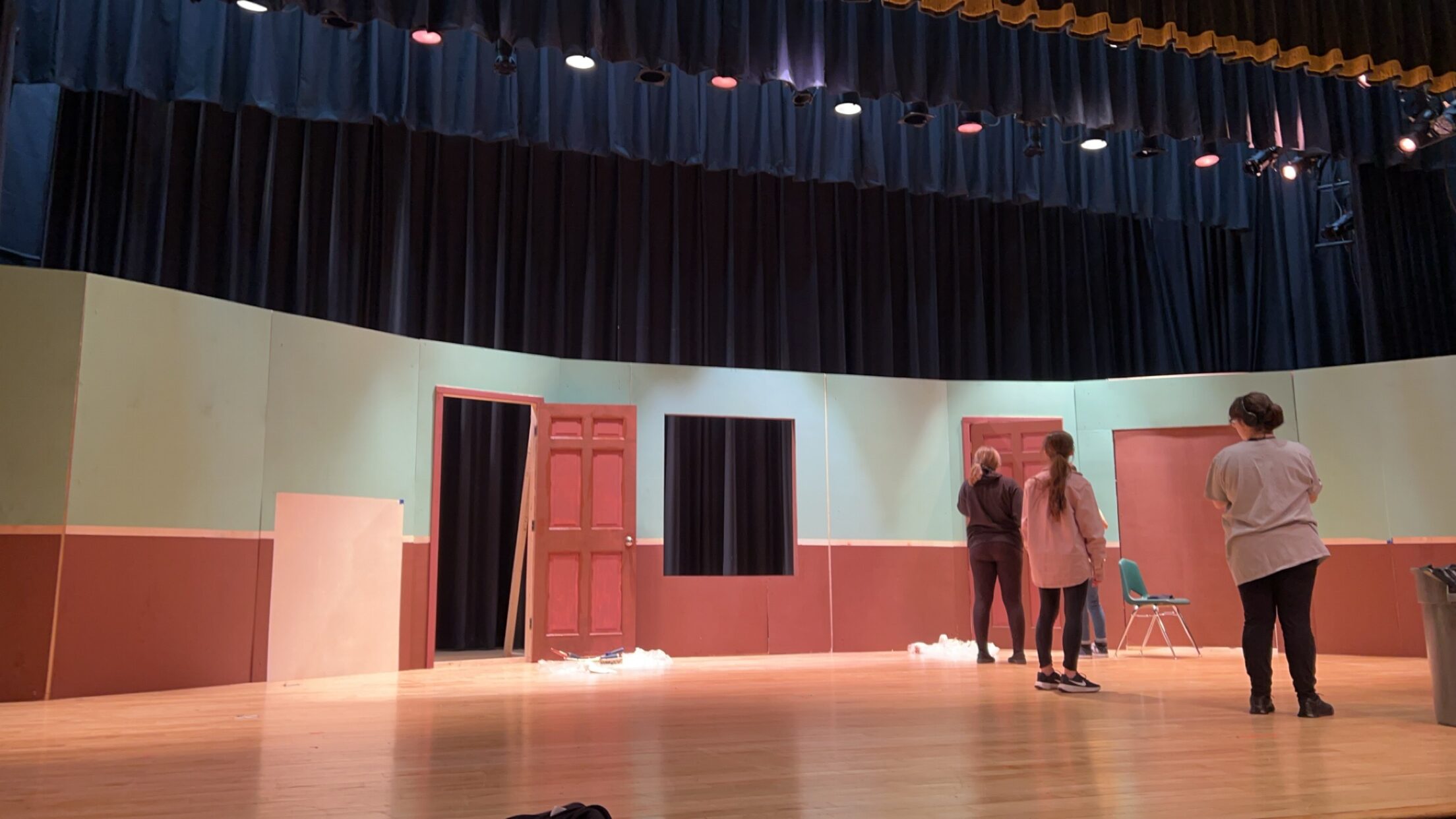 Theater students setting up set