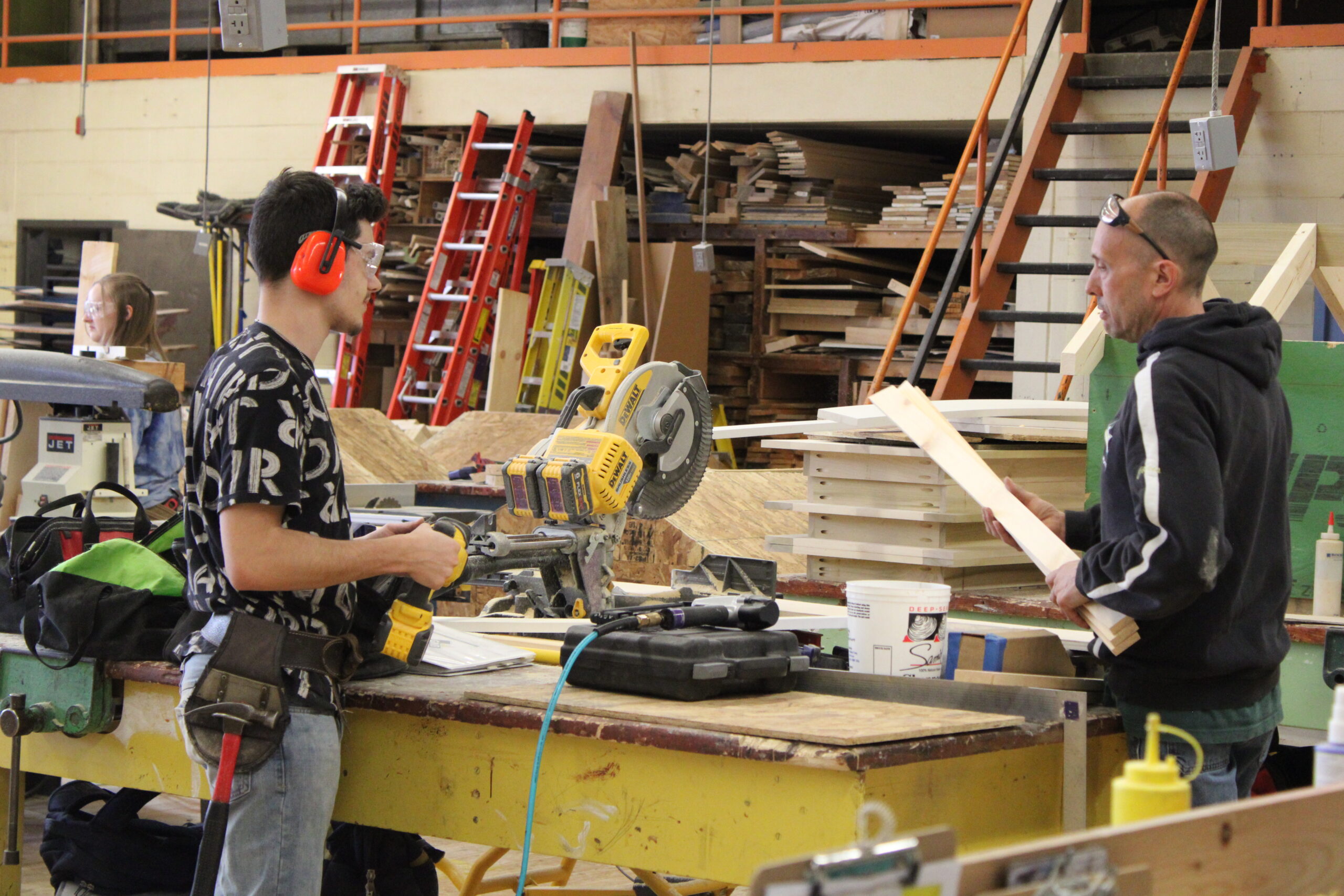 Students working in carpentry class with wood