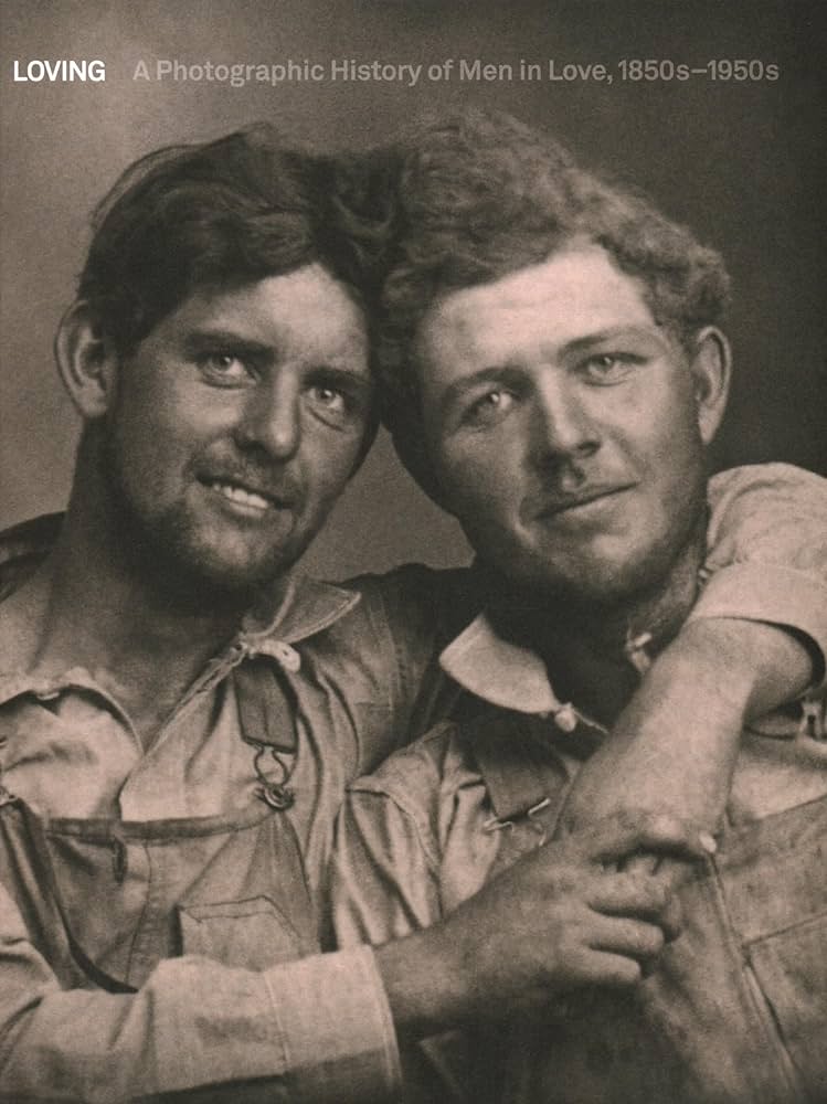 Front cover of Loving: A Photographic History of Men in love, 1850s-1950s. Shows two men smiling on the cover with one arm around the other resting on the others shoulder.