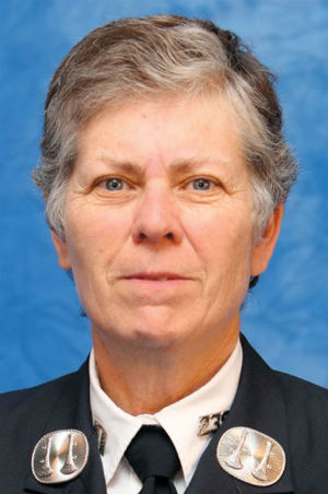 Brenda Berkman, a woman with short gray hair wearing a suit