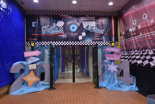 it is the entryway to 2024 after prom with a them of twist and shout - a 1950s car hop theme