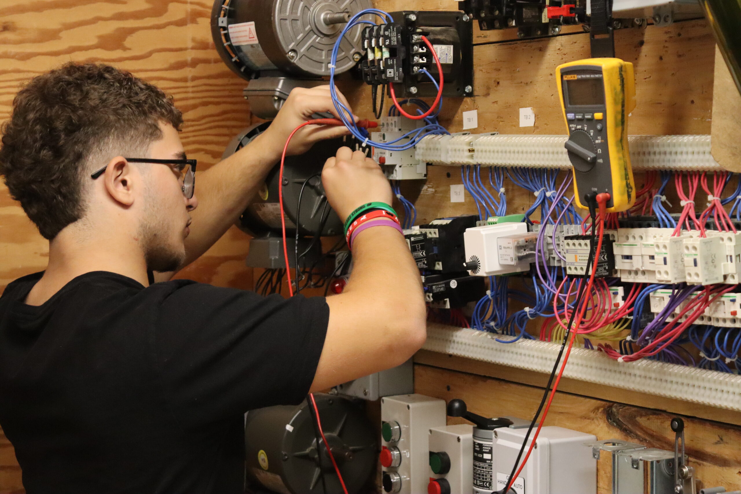 A student working with wires.