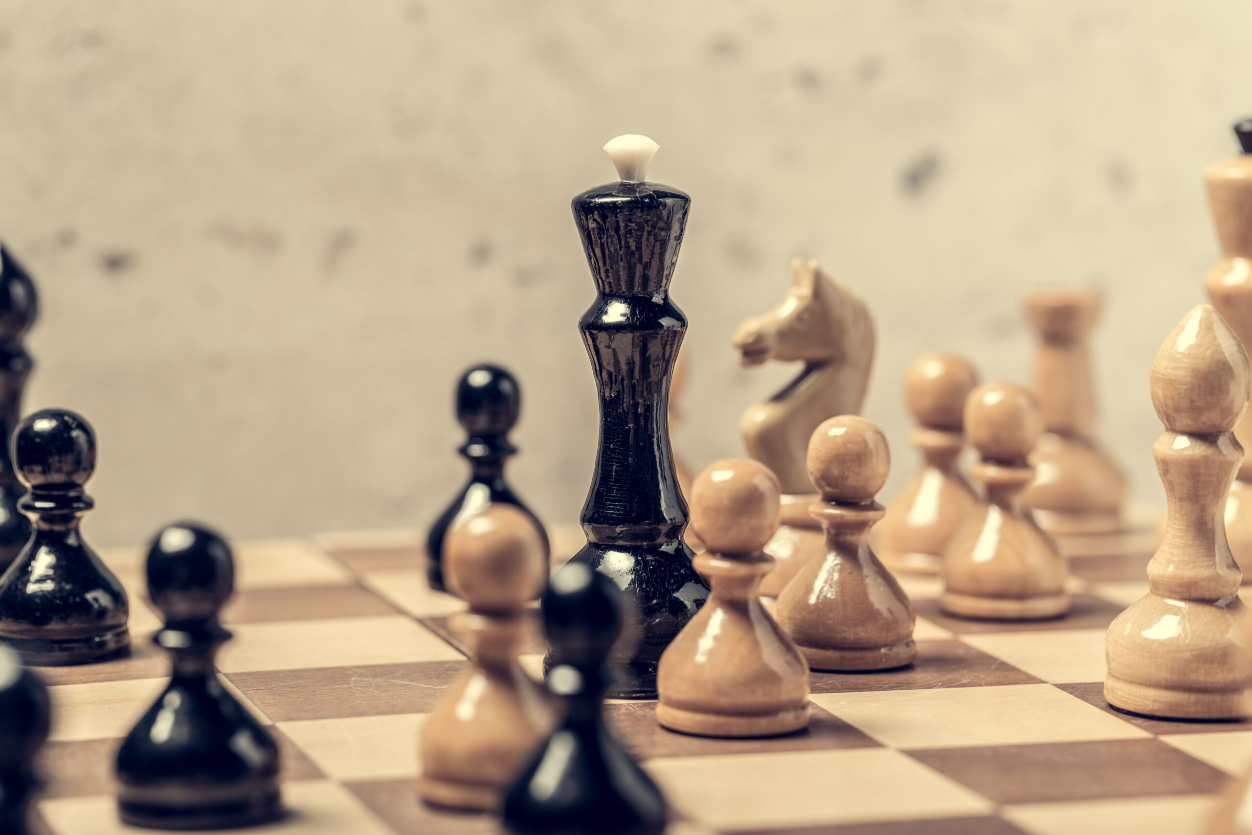 Chess pieces on the board in blur selective focus.