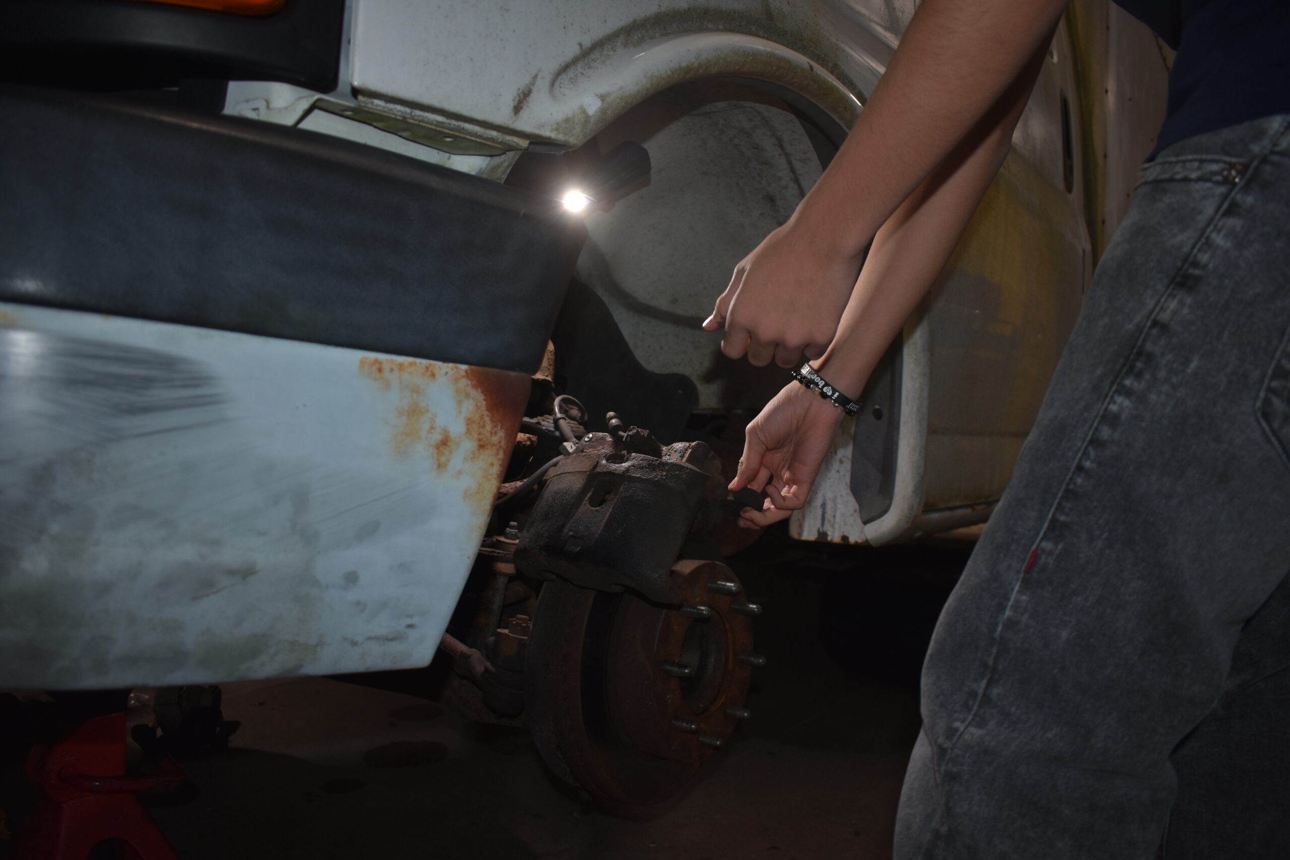 Student working on brakes