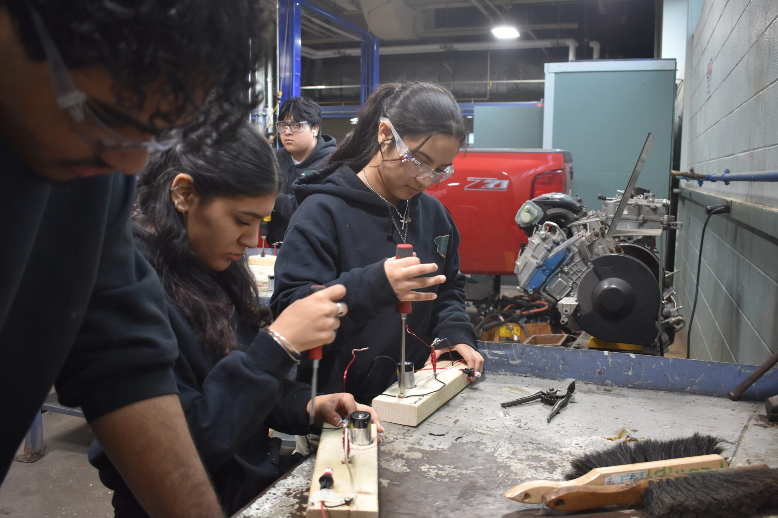 Students working together in a team putting wires together