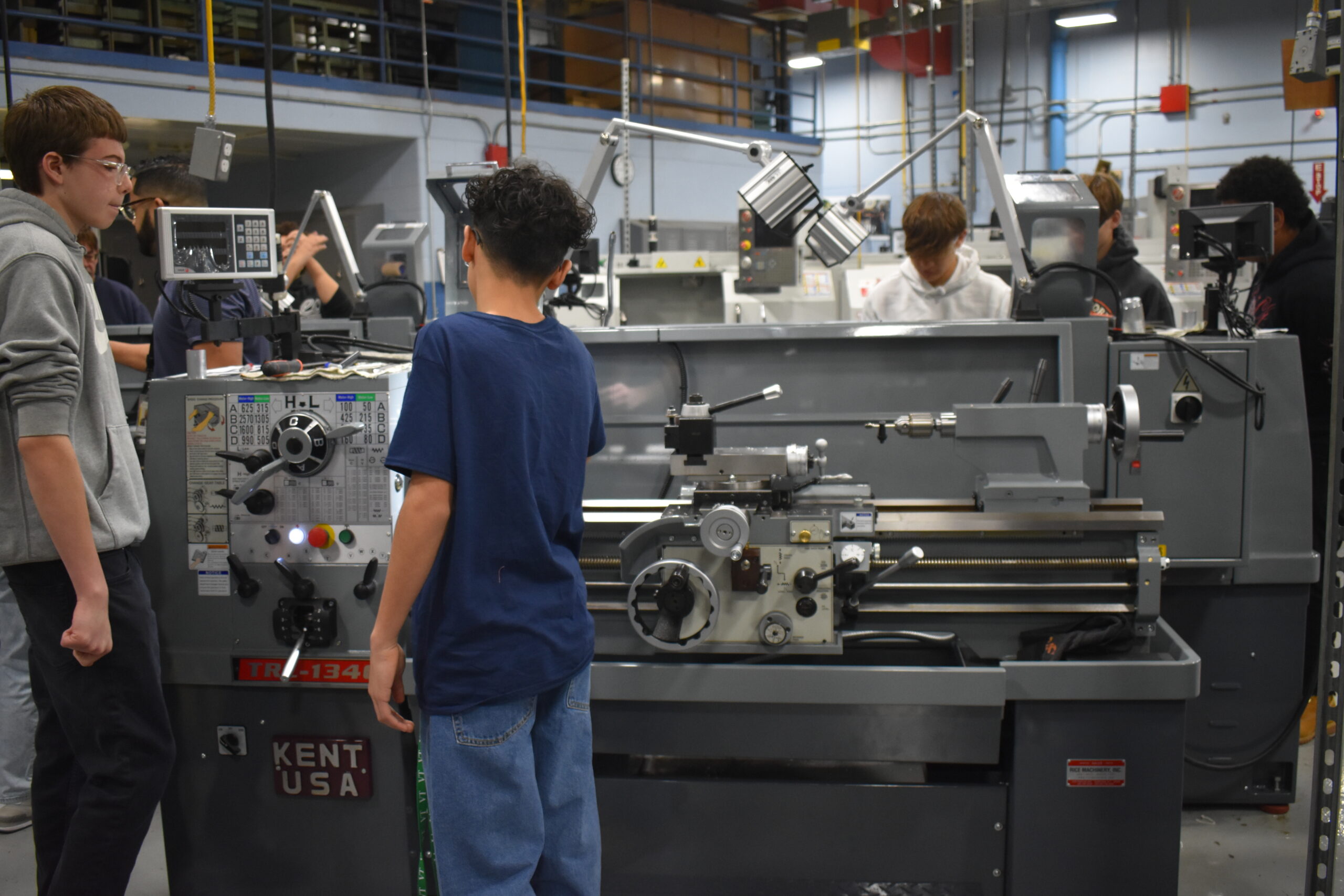 Students Socializing around a machine