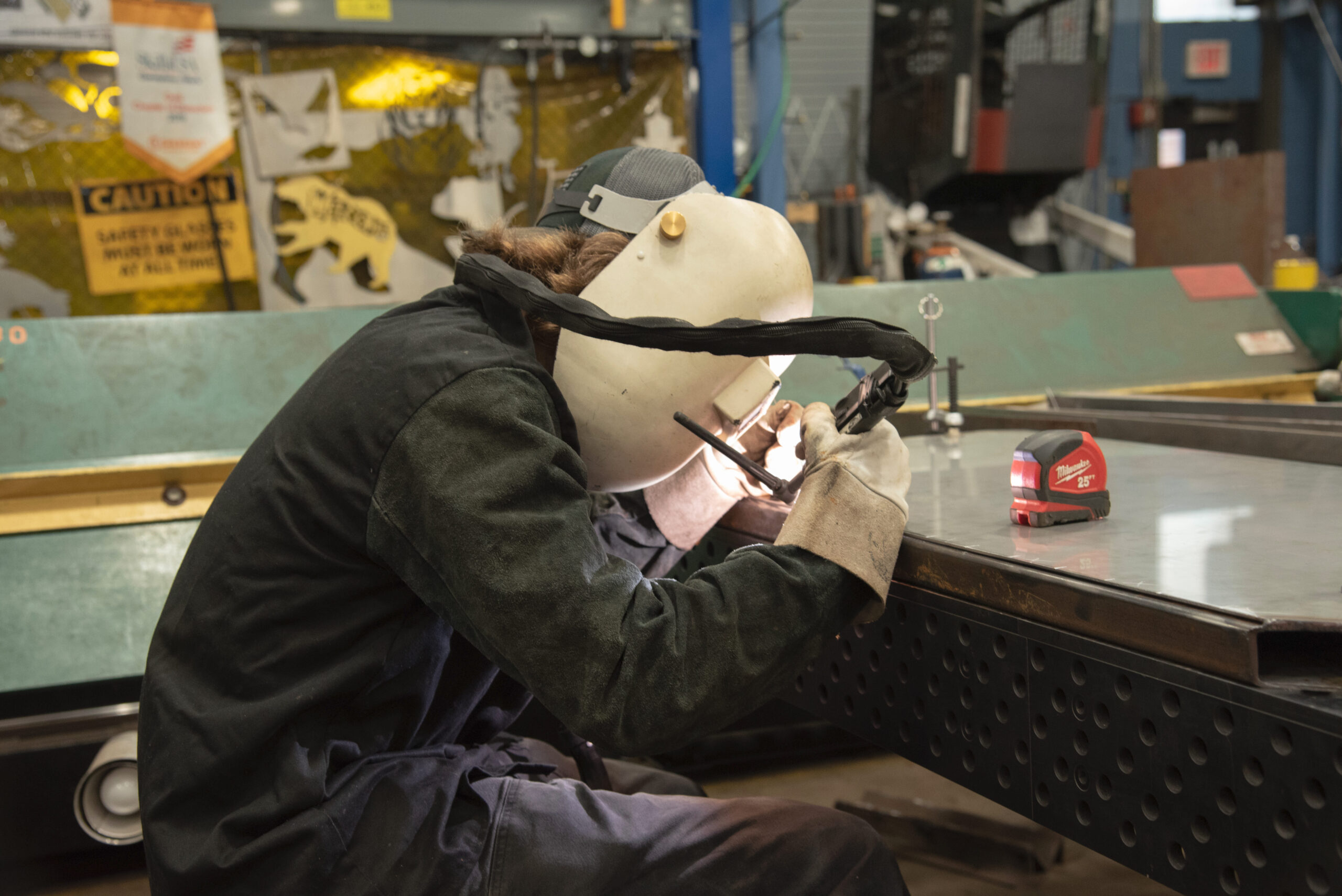 Metal Fabrication student using torch to weld