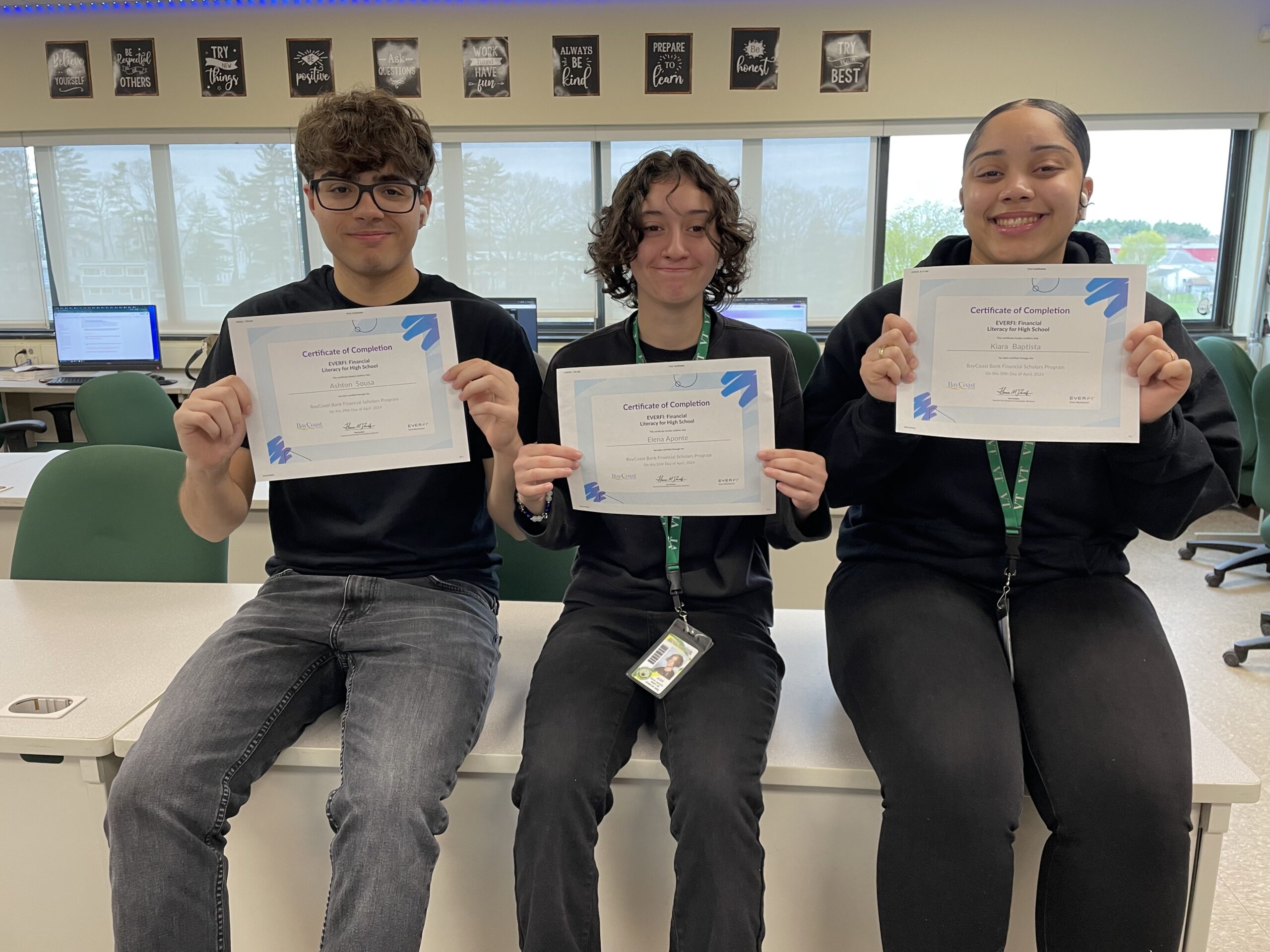 Business students holding up certificates