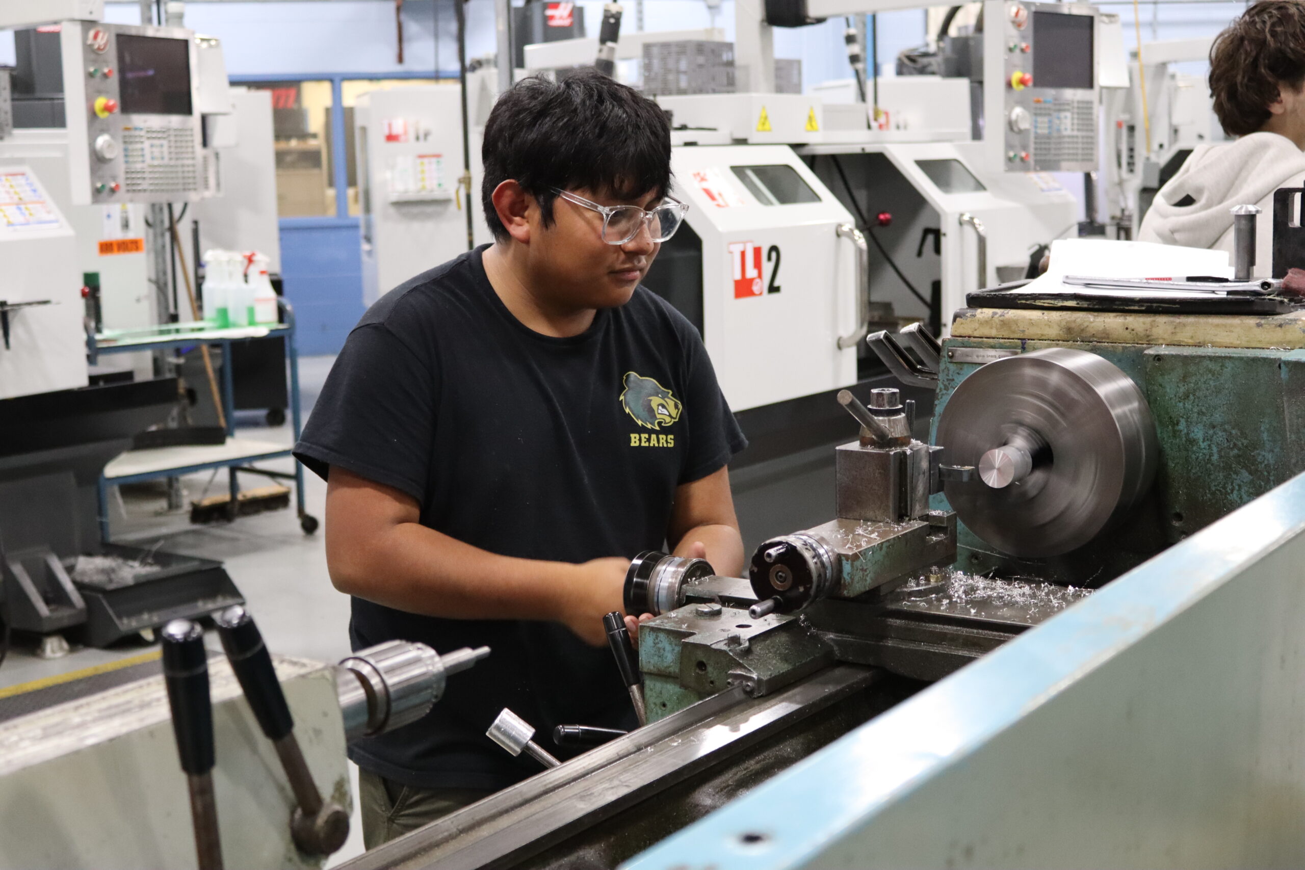 Student working on a machine