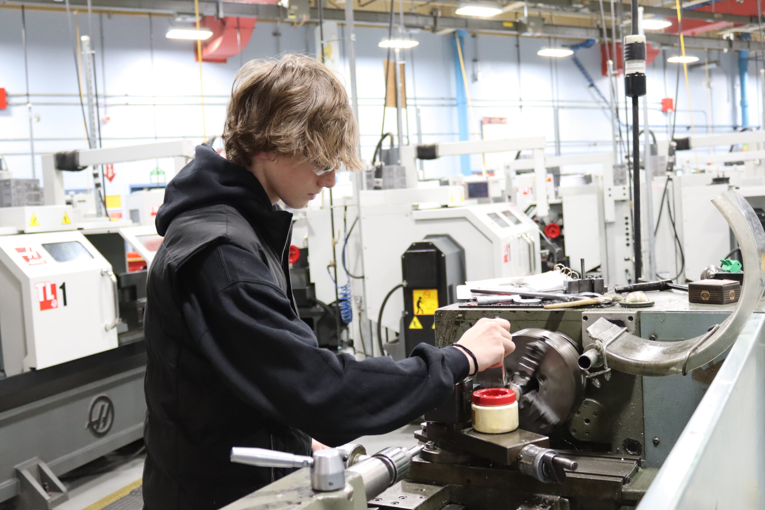 Student working on a machine