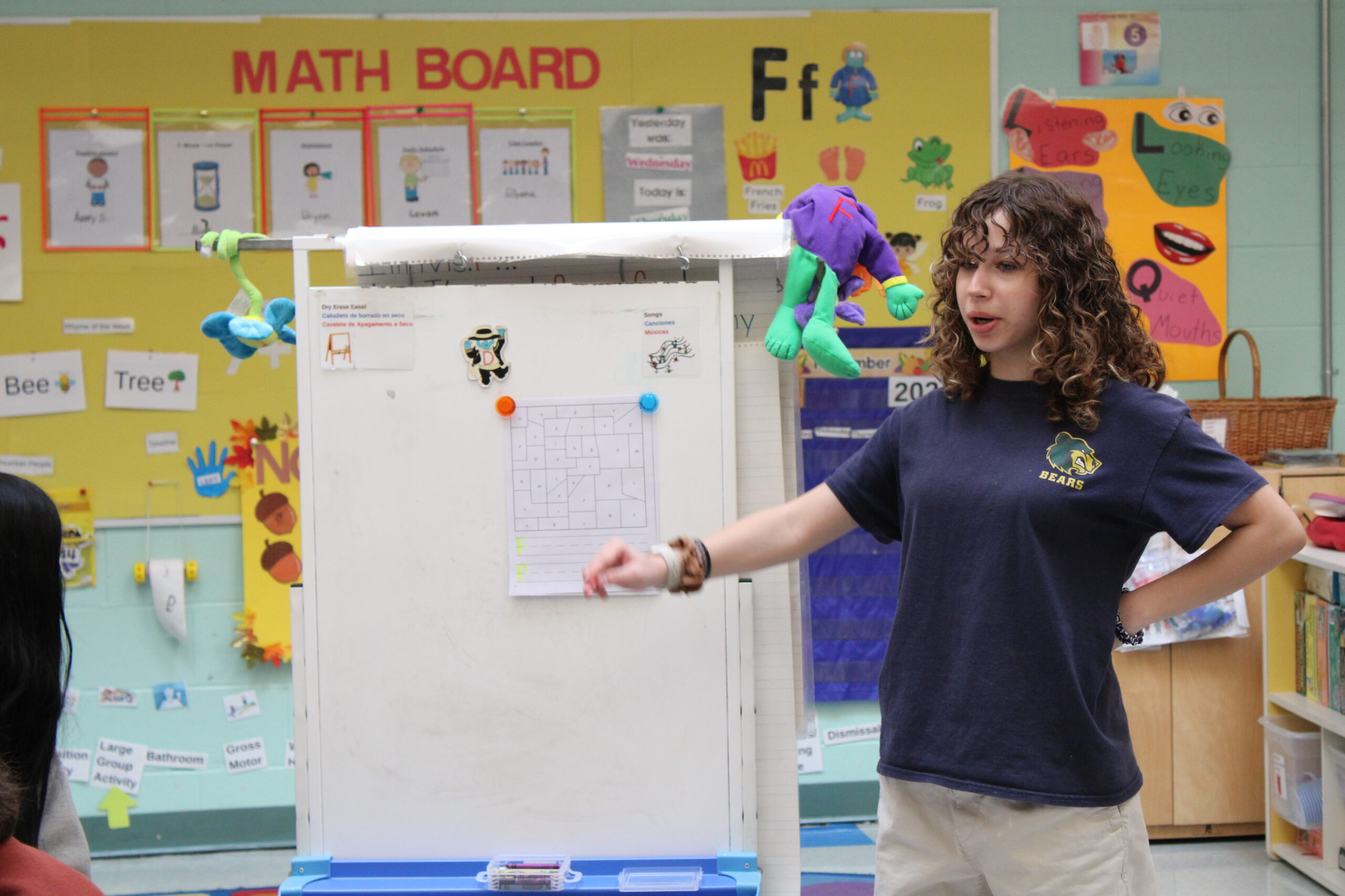 Early Childhood student standing at board<br />
