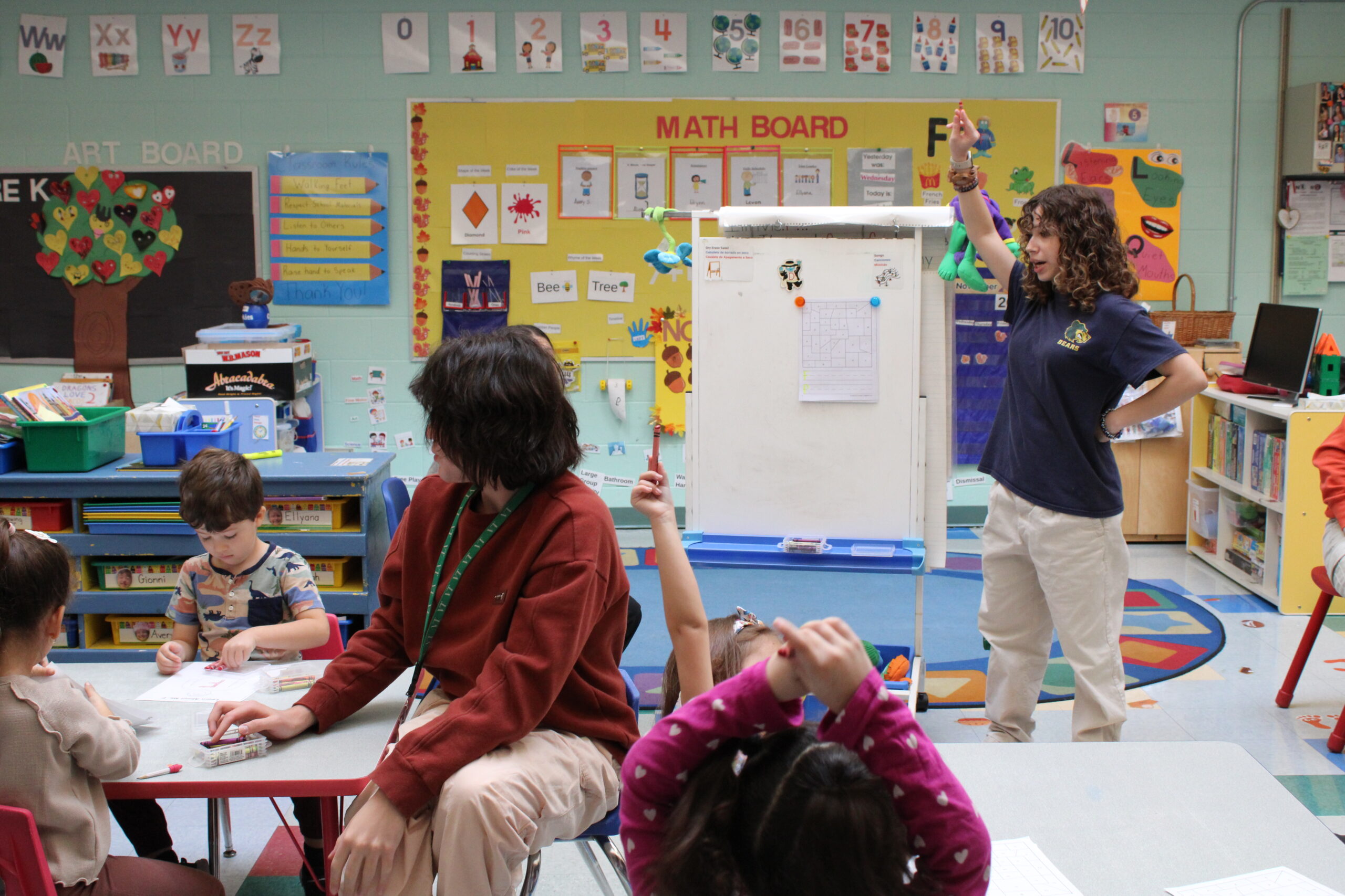 Early Childhood student standing in front of the room