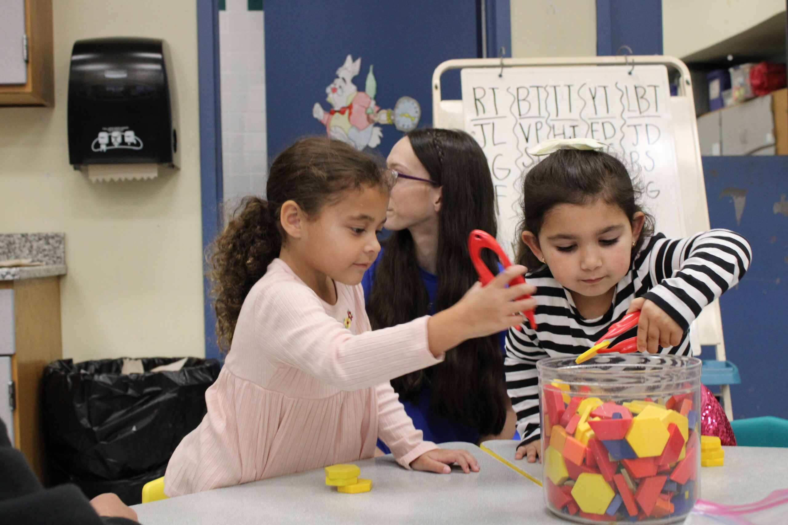 children playing with shape toys