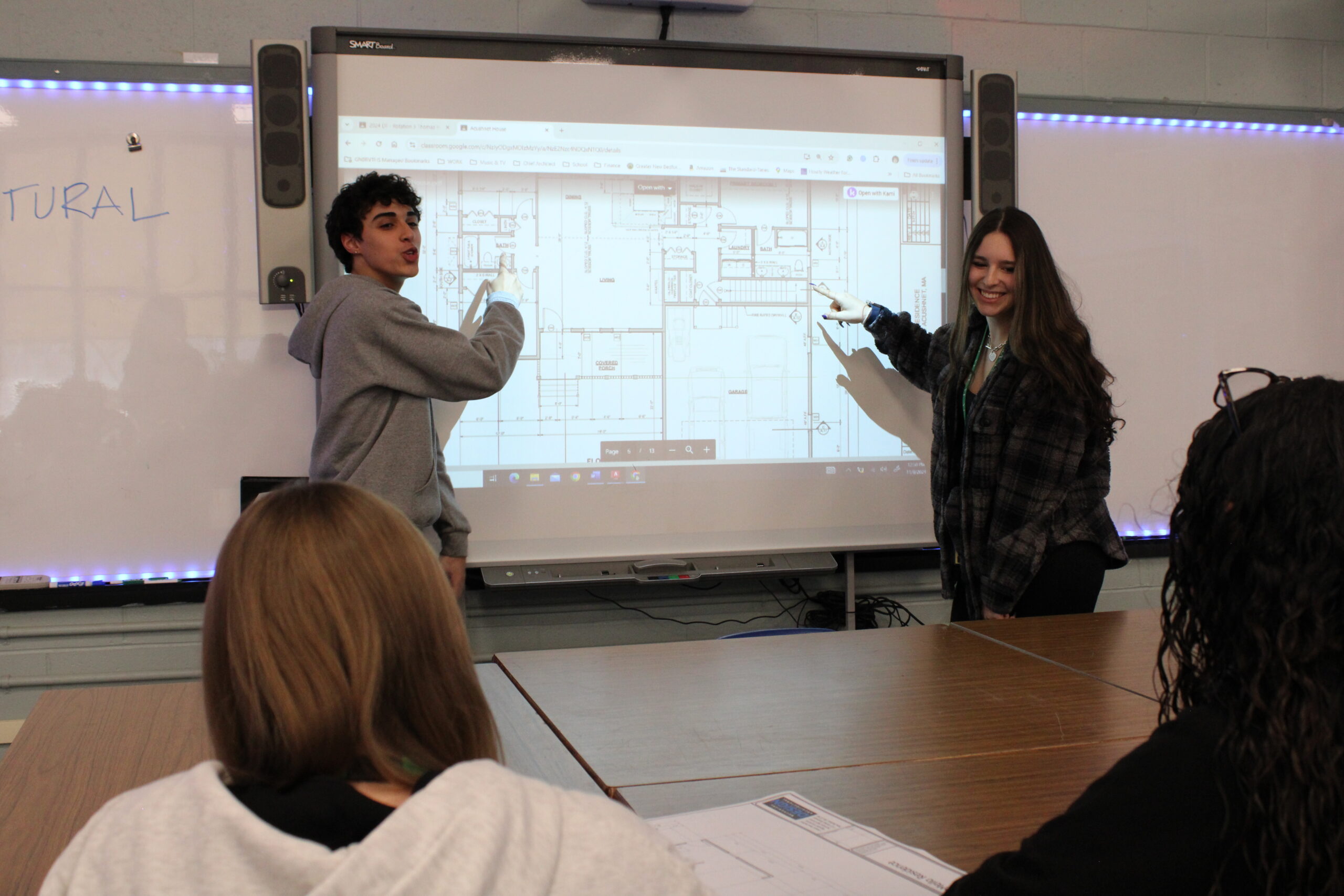 Students presenting the interior of a house design 