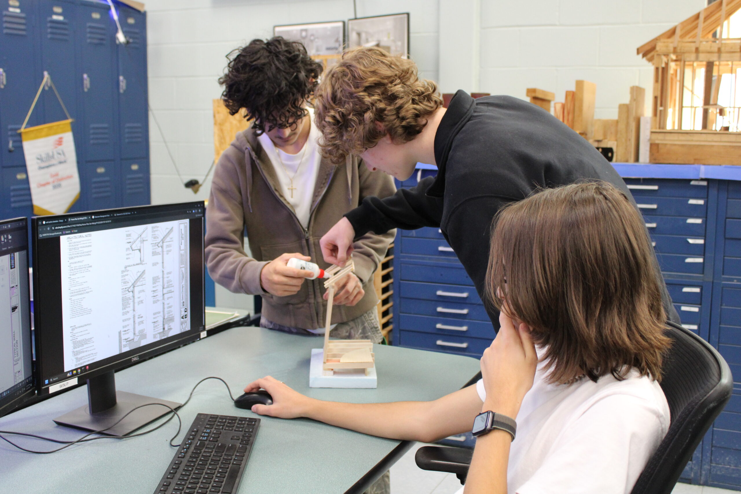  Students creating a small wooden model 