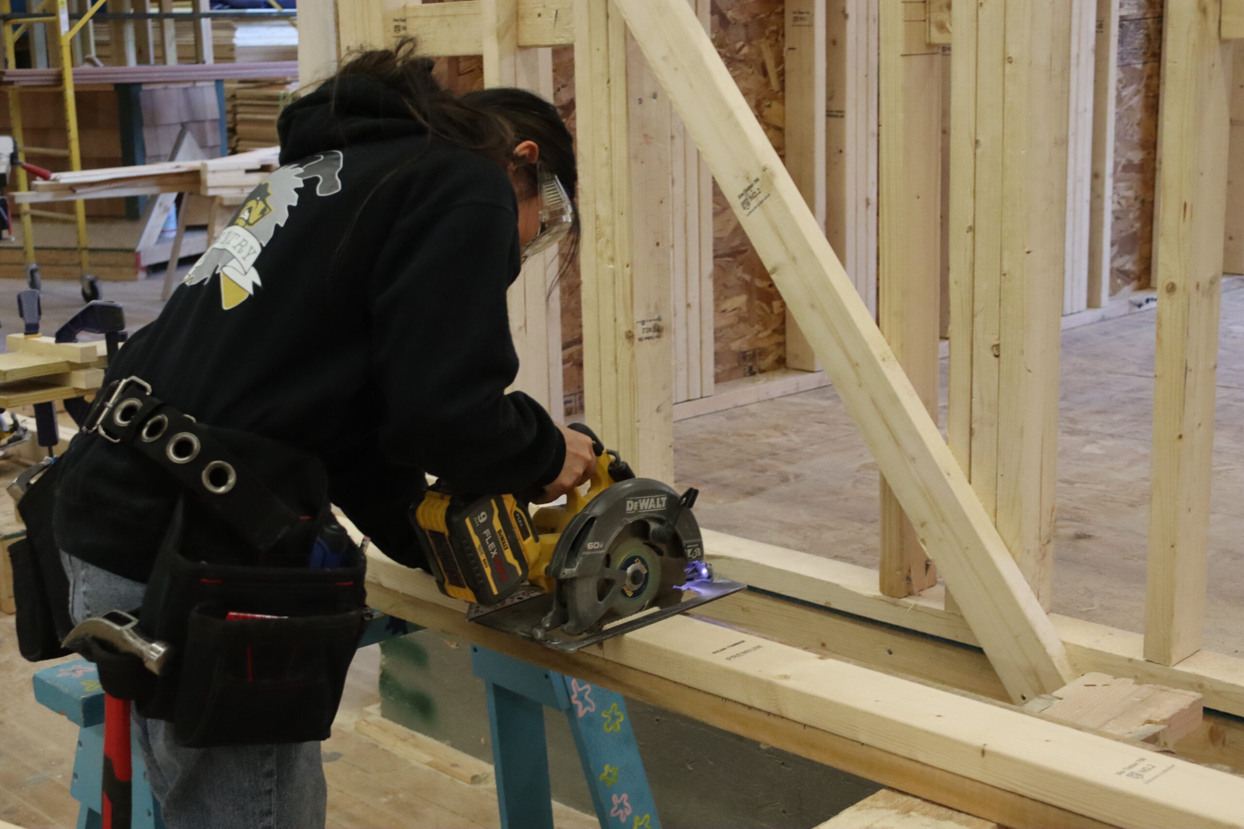 Carpentry students sanding a wooden box 